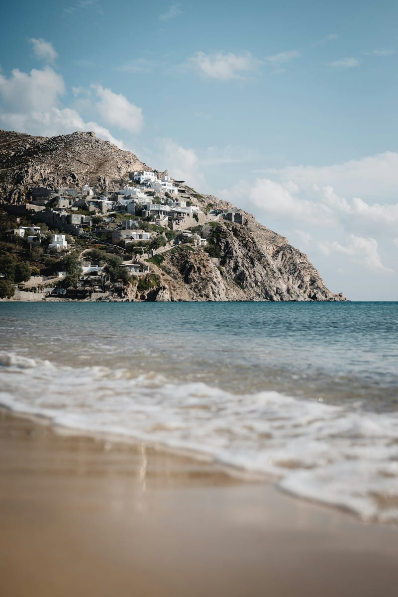 Quiet Mykonos shoreline and clear Aegean water